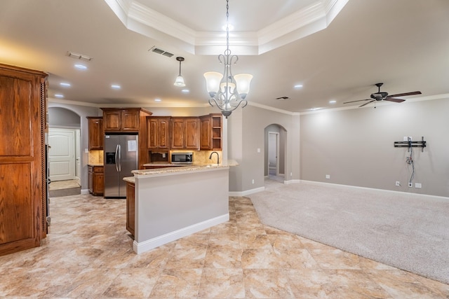 kitchen with light carpet, ceiling fan with notable chandelier, crown molding, appliances with stainless steel finishes, and decorative light fixtures