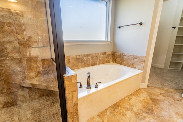 bathroom with plus walk in shower and tile patterned floors