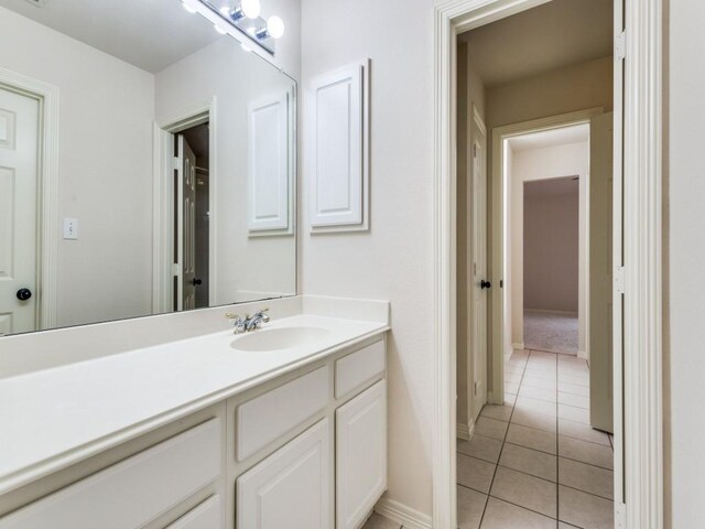 bathroom featuring tile patterned flooring and vanity