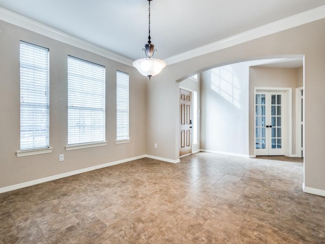 unfurnished room featuring crown molding and french doors