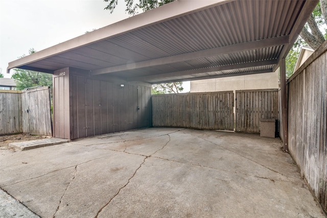 exterior space with a carport