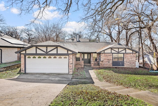 tudor home featuring a garage