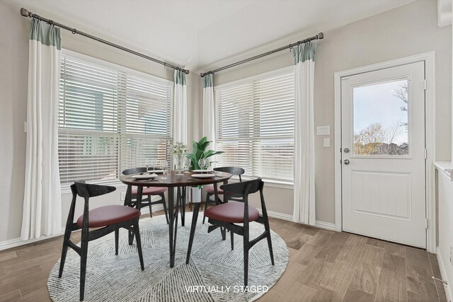 dining space with light wood-type flooring