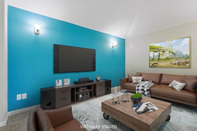 living room featuring vaulted ceiling