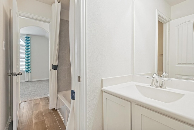 bathroom with shower / bath combination with curtain and vanity