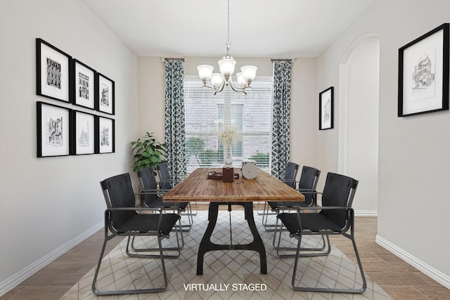 dining space with a chandelier