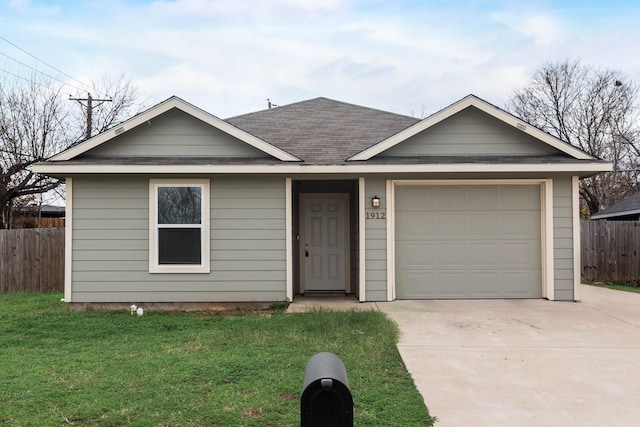 ranch-style house with a front yard and a garage