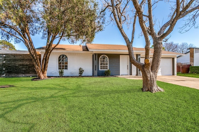 ranch-style house with a front yard and a garage