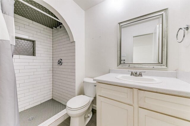 bathroom featuring vanity, a shower with shower curtain, and toilet