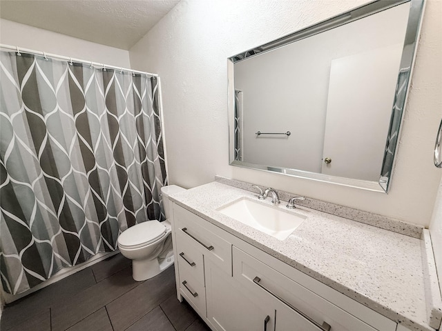 1629 Shreveport Trl, Plano, TX 75023 - full bath featuring toilet, vanity, and a shower with shower curtain