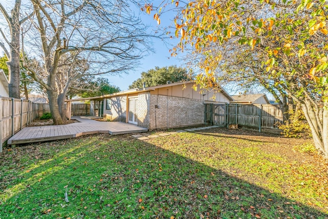 view of yard with a wooden deck