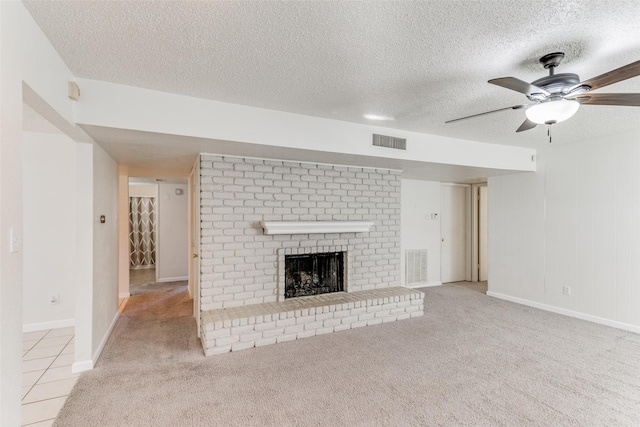 1629 Shreveport Trl, Plano, TX 75023 - unfurnished living room featuring a ceiling fan, a brick fireplace, carpet, a textured ceiling, and baseboards