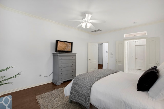 bedroom featuring ceiling fan, crown molding, and hardwood / wood-style floors