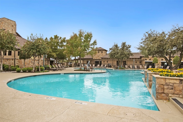 view of pool featuring a patio area and pool water feature