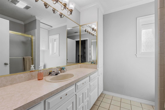 bathroom featuring vanity, tile patterned floors, crown molding, toilet, and a shower with shower door