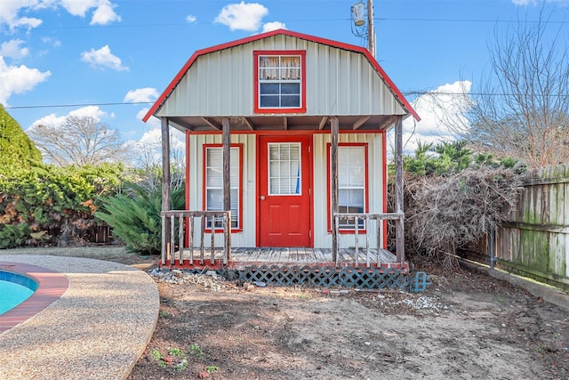 view of outbuilding featuring covered porch