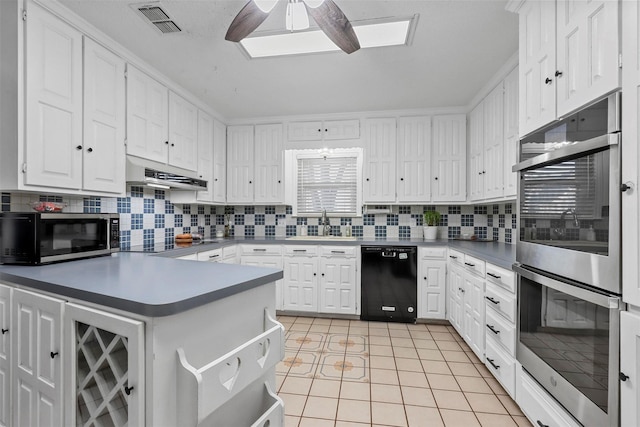 kitchen featuring black appliances, ceiling fan, decorative backsplash, light tile patterned flooring, and white cabinetry