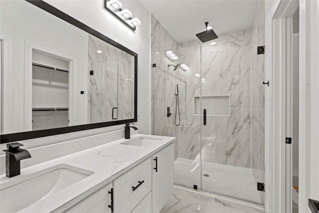 bathroom with vanity and a shower with shower door