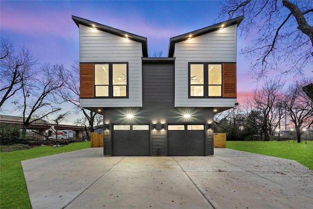 exterior space featuring a lawn and a garage