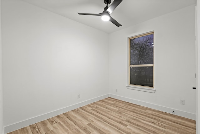 empty room featuring ceiling fan and light hardwood / wood-style flooring