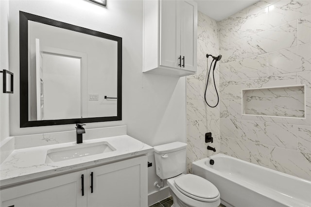 full bathroom featuring vanity, toilet, and tiled shower / bath combo