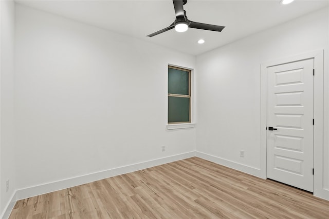 empty room with light hardwood / wood-style floors and ceiling fan