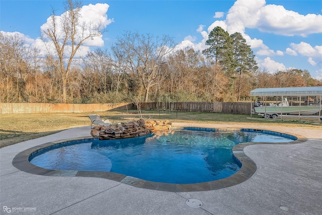 view of pool featuring a yard