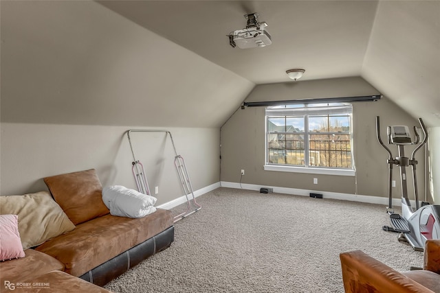 interior space featuring vaulted ceiling and carpet