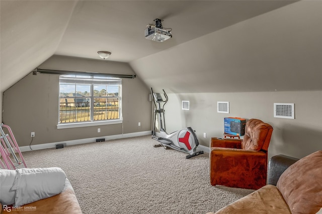 exercise area with vaulted ceiling and carpet floors