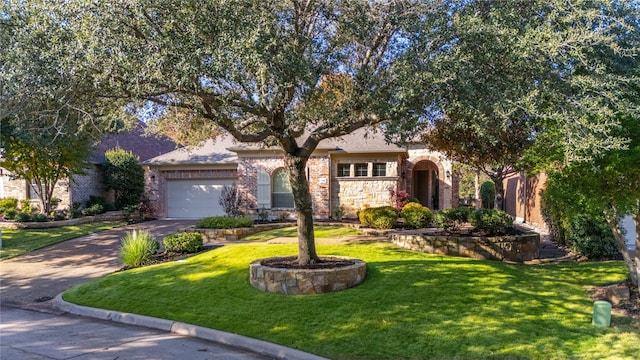 view of front of home with a garage and a front yard