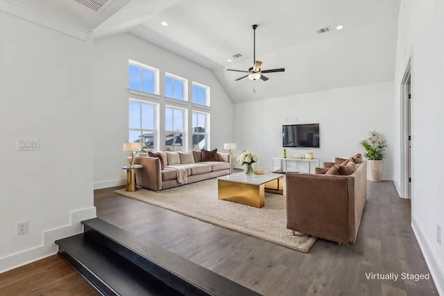 living room featuring dark hardwood / wood-style floors, high vaulted ceiling, and ceiling fan