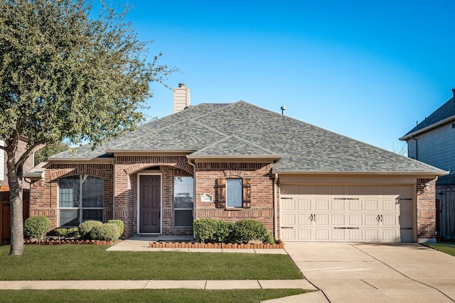 ranch-style house featuring a garage and a front lawn