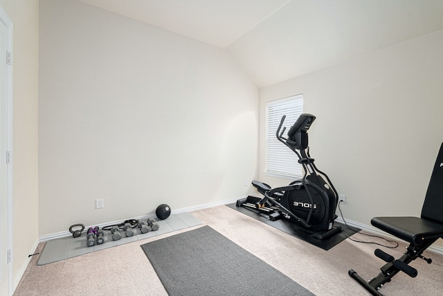 workout area featuring carpet and lofted ceiling