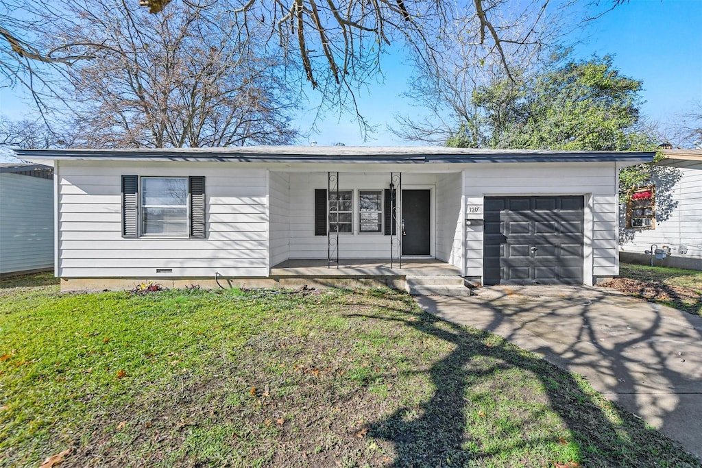 single story home with a garage, covered porch, and a front lawn