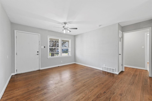 interior space with ceiling fan and dark hardwood / wood-style floors