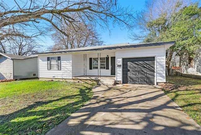 ranch-style house with a porch, a garage, and a front lawn