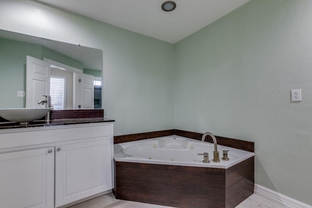 bathroom featuring vanity and a bathing tub