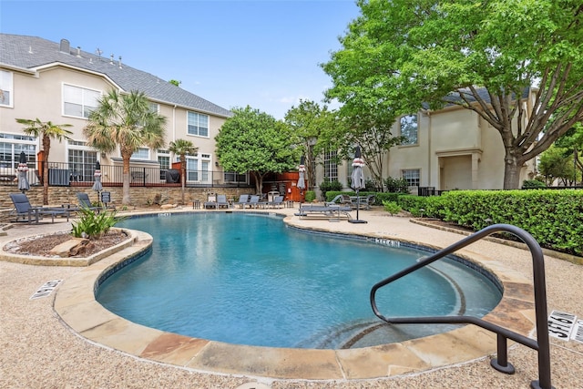 view of swimming pool with a patio