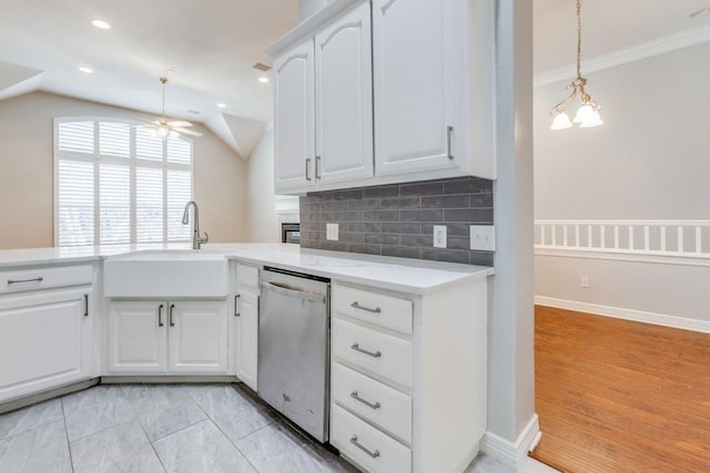 kitchen featuring sink, white cabinetry, dishwasher, ceiling fan, and backsplash