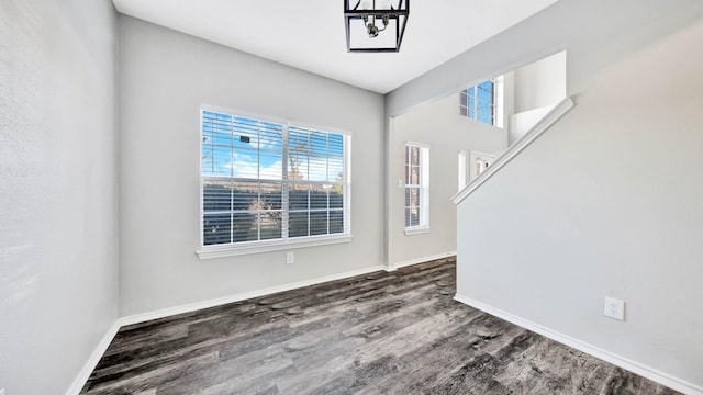 entrance foyer featuring a chandelier and dark hardwood / wood-style floors