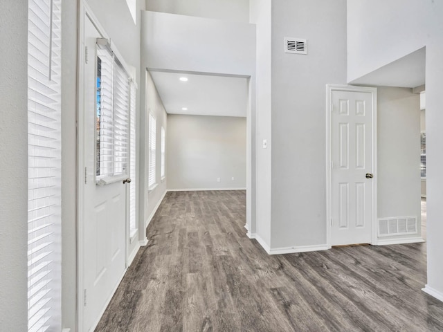 hall with hardwood / wood-style flooring