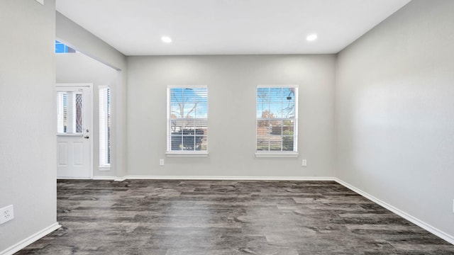 spare room with dark hardwood / wood-style floors