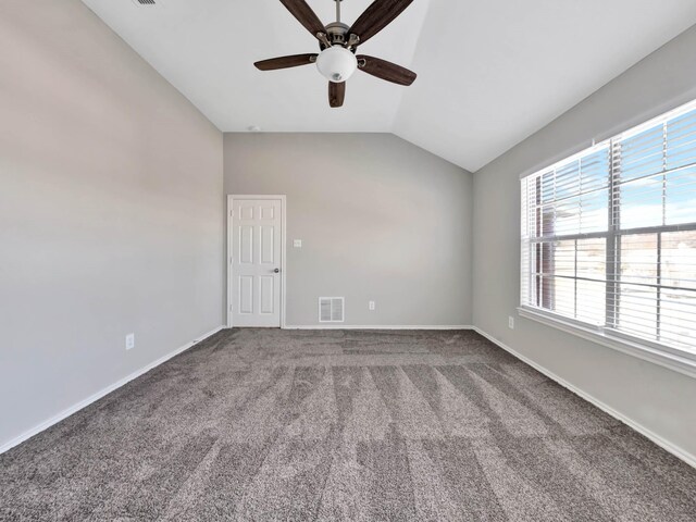 spare room with carpet, ceiling fan, and lofted ceiling