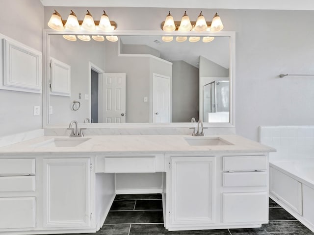 bathroom featuring tile patterned floors, vanity, and plus walk in shower