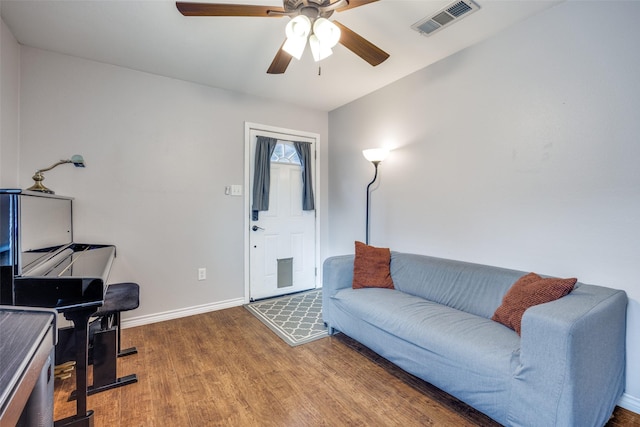 living room with ceiling fan and hardwood / wood-style flooring