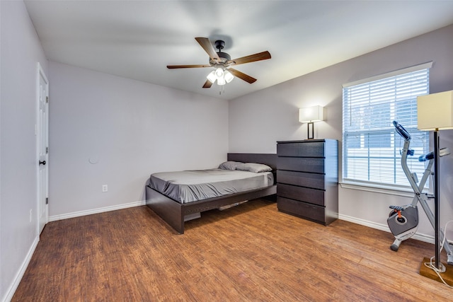 bedroom featuring wood-type flooring and ceiling fan