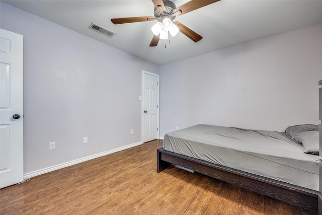 bedroom featuring ceiling fan and wood-type flooring