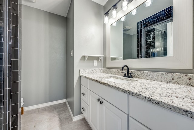 bathroom featuring tile patterned floors and vanity