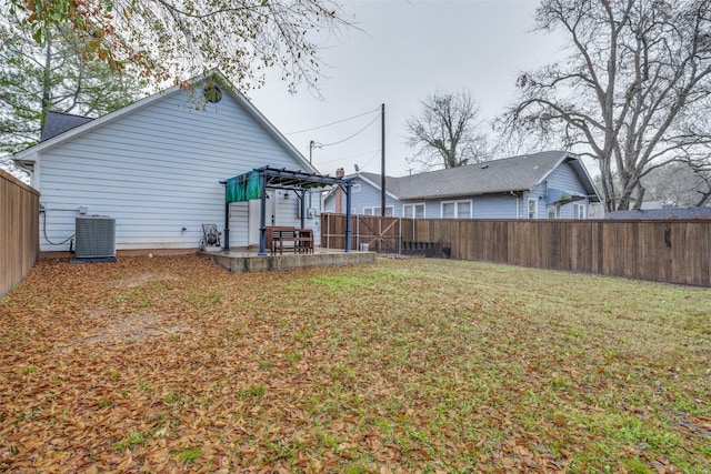 view of yard with a patio and central air condition unit