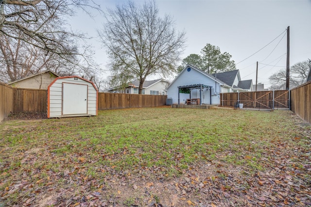 view of yard with a storage unit and a pergola